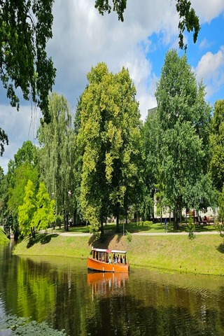 DAY TRIP BY BOAT IN RIGA CANAL AND DAUGAVA WITH COMPLIMENTORY WELCOME DRINK